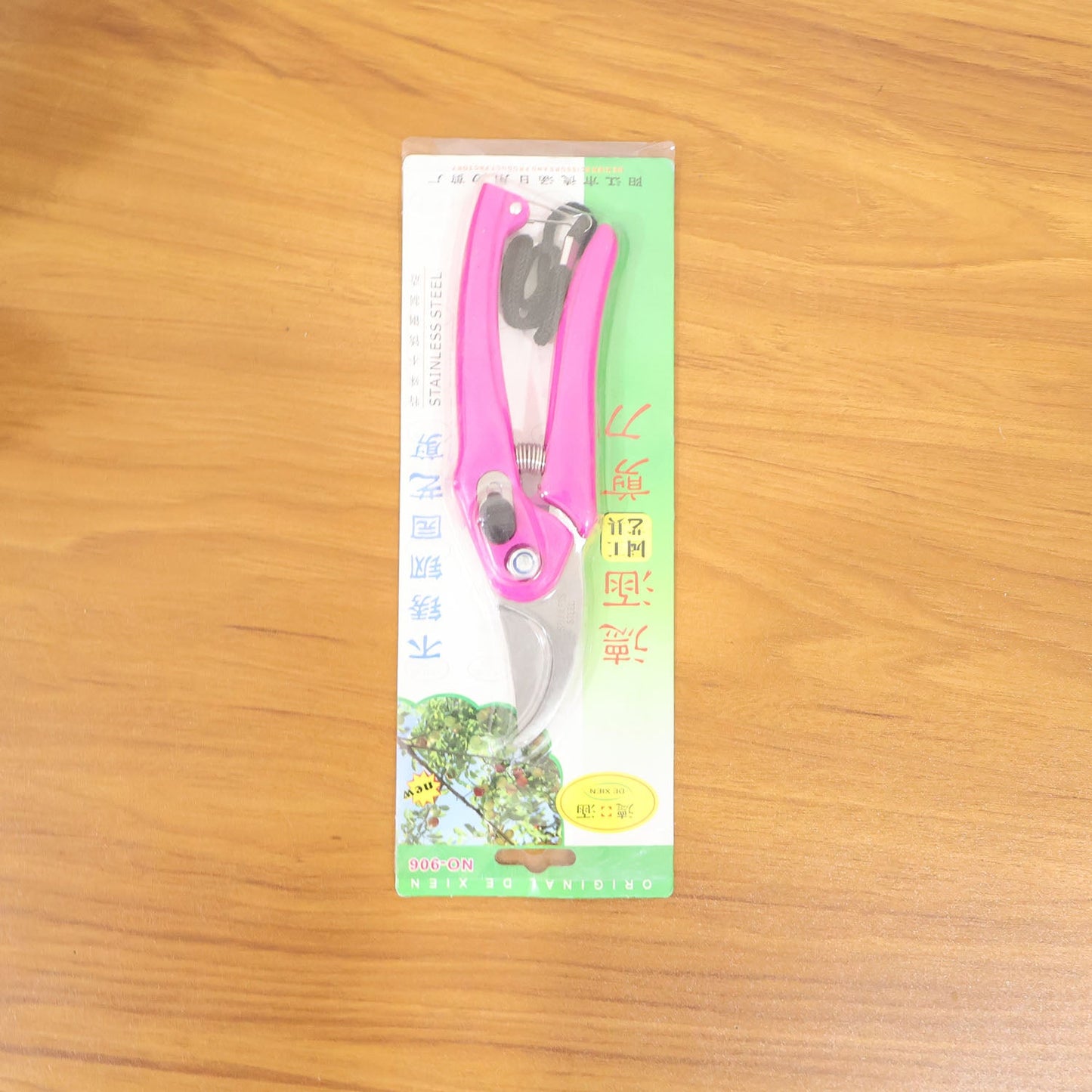 Gardener using the flower cutter to prune live plants with precision.