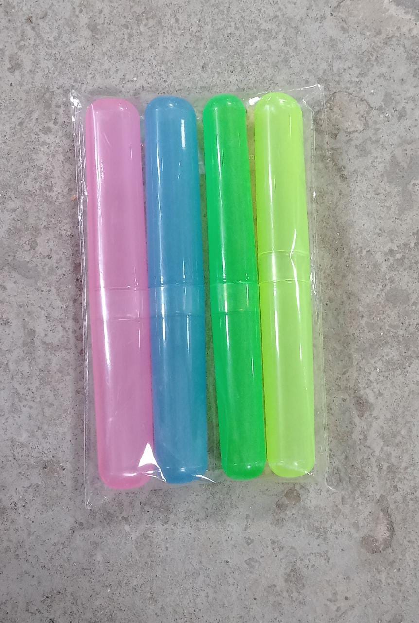 A hand holding a plastic toothbrush cover, demonstrating its portable size.