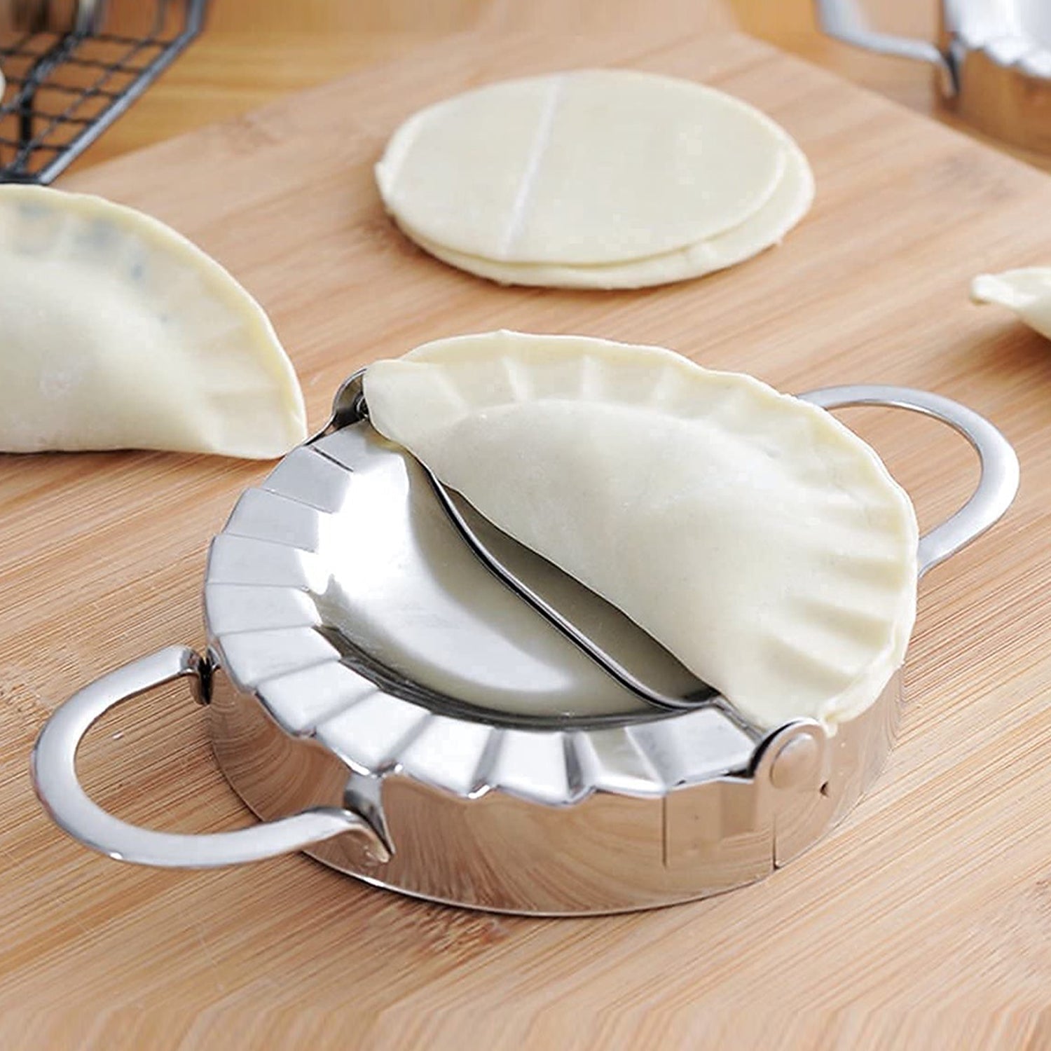Detailed shot of the ergonomic handle on the dumpling dough cutter.