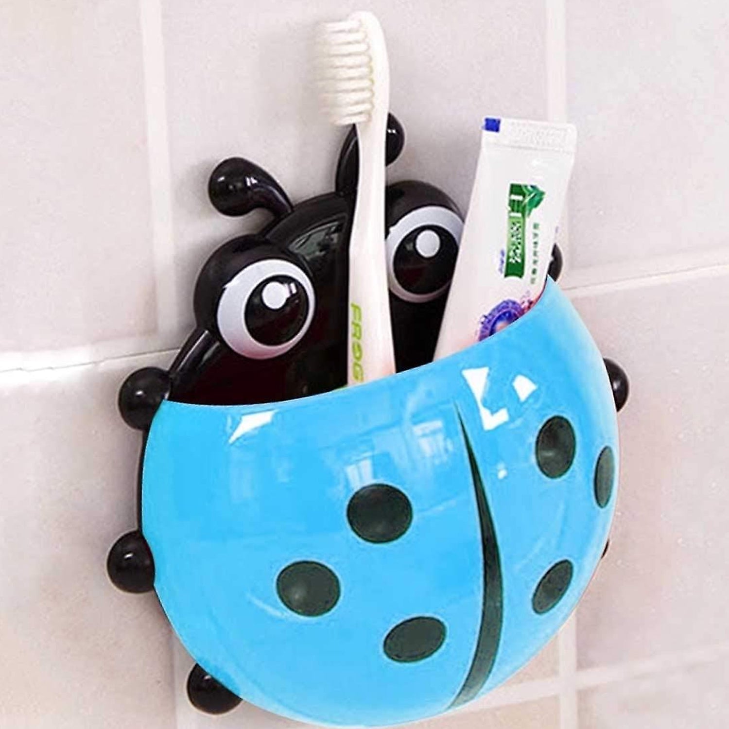 Ladybug toothbrush holder holding multiple toothbrushes for family use.