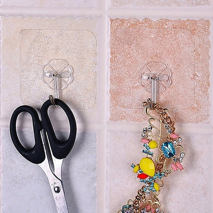 The full 100-pack of multipurpose stainless steel adhesive wall hooks, ready for use.