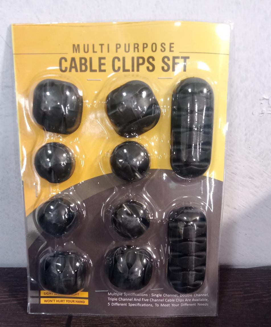 Lifestyle shot of cable organiser clips effectively managing cables in a modern workspace.