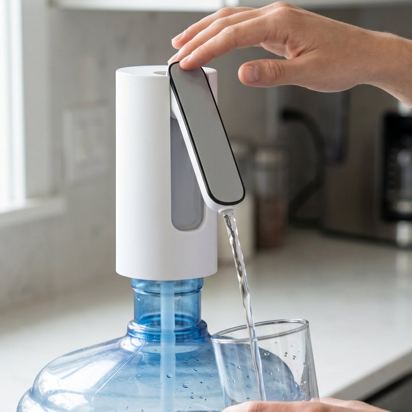 Person using water dispenser pump on a gallon bottle