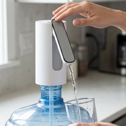 Person using water dispenser pump on a gallon bottle