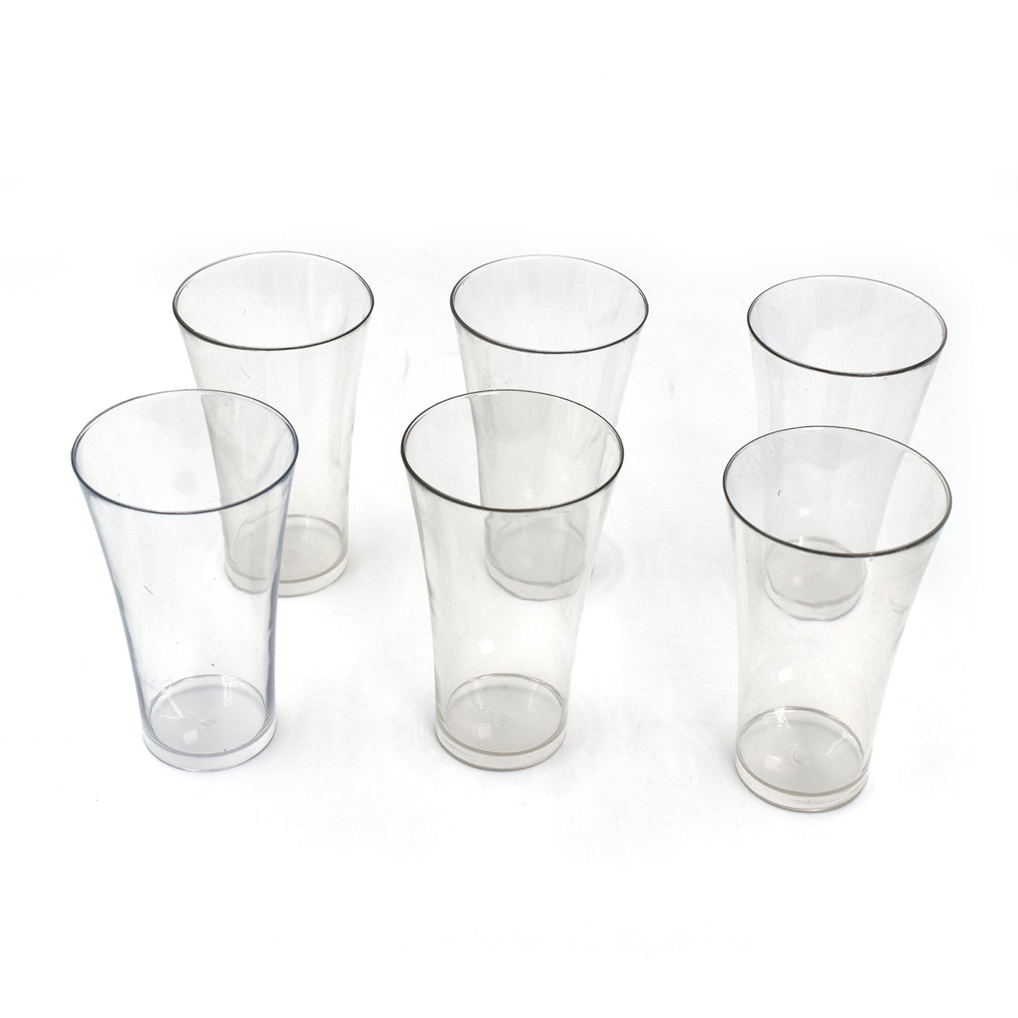 Transparent plastic drinking glasses filled with refreshing beverages.