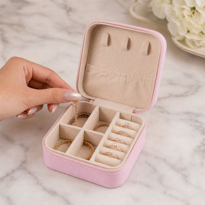 A closed LilyGleam Mini PU Leather Travel Jewellery Box in a stylish pink shade, perfect for organising accessories.